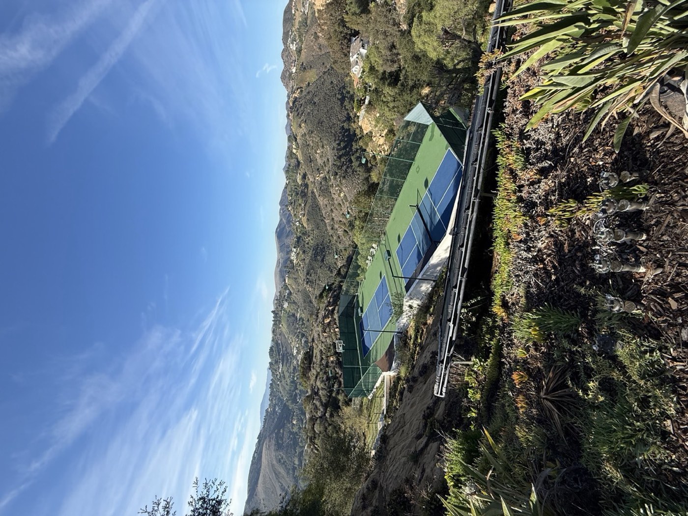 Hillside court with mountain views